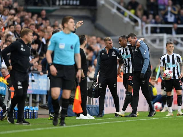 Joe Willock of Newcastle United leaves the pitch after picking up an injury during the Premier League match between Newcastle United and Brighton & Hove Albion at St. James Park on May 18, 2023 in Newcastle upon Tyne, England. (Photo by Stu Forster/Getty Images)
