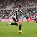 Newcastle United teenager Lewis Miley with Florian Lejeune.  (Photo by Stu Forster/Getty Images)