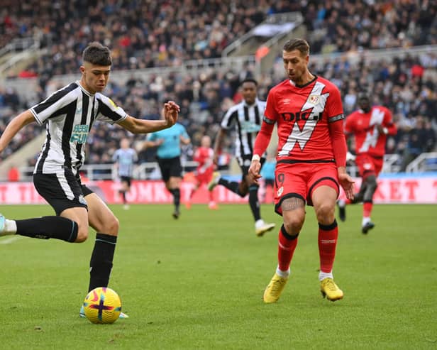 Newcastle United teenager Lewis Miley with Florian Lejeune.  (Photo by Stu Forster/Getty Images)