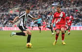 Newcastle United teenager Lewis Miley with Florian Lejeune.  (Photo by Stu Forster/Getty Images)