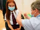 Jabs in England are currently being carried out in schools by nurses and immunisation teams (Photo: Getty Images)