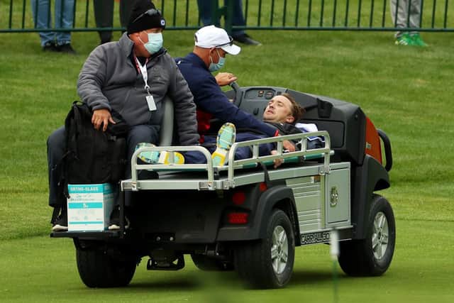 Tom Felton is carted off the course after collapsing during the celebrity match (Photo: Andrew Redington/Getty Images)