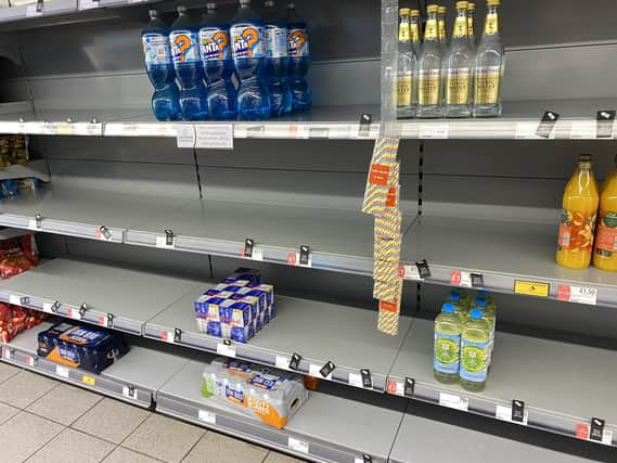 Photo taken with permission from the Twitter feed of @HapG86 of empty shelves in a Co-op (PA)