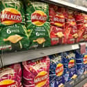 Crisp packets in the supermarket (Shutterstock)