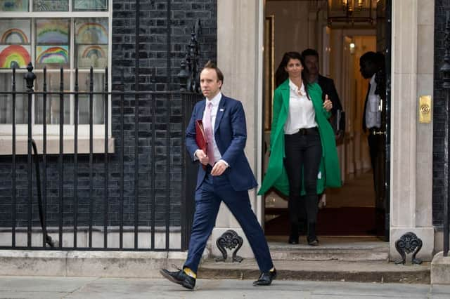 Matt Hancock seen leaving No 10 with Gina Coladangelo in May (Photo: Getty)