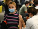 A woman receives a vaccine at the Chelsea F.C. pop up vaccine hub (Photo: Hollie Adams/Getty Images)