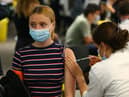 A woman receives a vaccine at the Chelsea F.C. pop up vaccine hub (Photo: Hollie Adams/Getty Images)