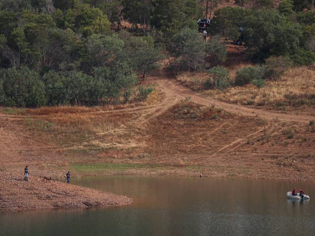 Portuguese firefighterOfficials are seen during a new search operation amid the investigation into the disappearance of Madeleine McCann in the Arade dam, in Silves, near Praia da Luz, on 23 May, 2023.