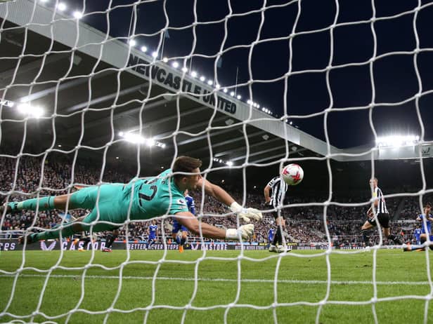 Newcastle United's Nick Pope denies Leicester City's Timothy Castagne.