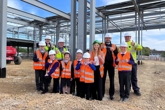 From left to right: Louise Norris, NEAS; Maurice Griffiths, Esh Construction; Finley, St Aloysius Catholic Primary School Academy; Kadyn, Hebburn Lakes Primary School; Harry, St Aloysius Catholic Primary School Academy; Sonny, Toner Avenue Primary School; Porscha, Toner Avenue Primary School; Kate Marshall Nixon, Esh Construction; Chief Inspector Neil Hall, Northumbria Police; Jayden, Hebburn Lakes Primary School; and Station Manager Steven Bewick, TWFRS. Photo: TWFRS. 
