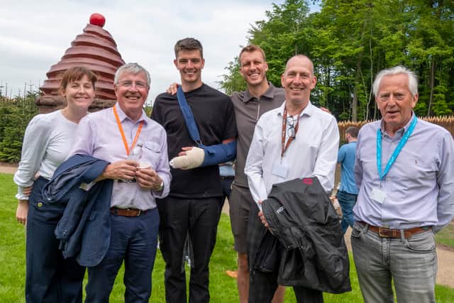 Newcastle United goalkeeper Nick Pope, third left, at Alnwick Garden following surgery on his fingers.
