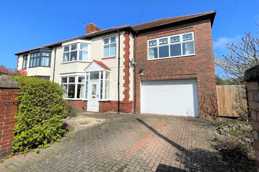 The front of the property has a driveway that offers off road parking for a couple of cars