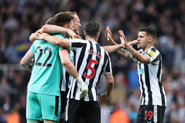 Newcastle United's Bruno Guimaraes, right, celebrates Champions League qualifcation with his team-mates, including Nick Pope, far left, late last season. (Pic: Getty Images)