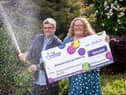 National Lottery winners Liz and George Galloway celebrate after winning Â£300,000 on the National Lottery Bingo Bonus Scratch card in Glasgow. (Photo: Anthony Devlin)