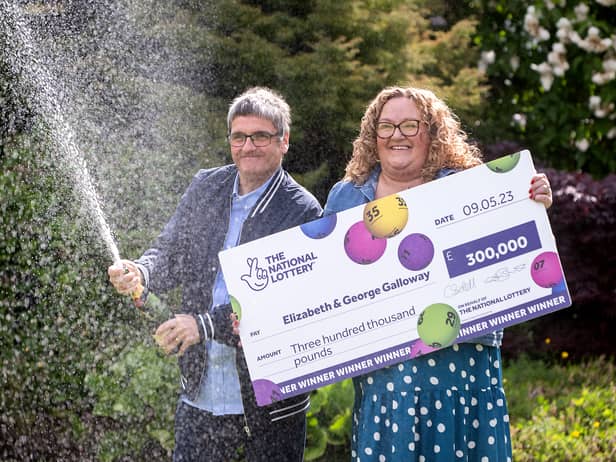 National Lottery winners Liz and George Galloway celebrate after winning Â£300,000 on the National Lottery Bingo Bonus Scratch card in Glasgow. (Photo: Anthony Devlin)