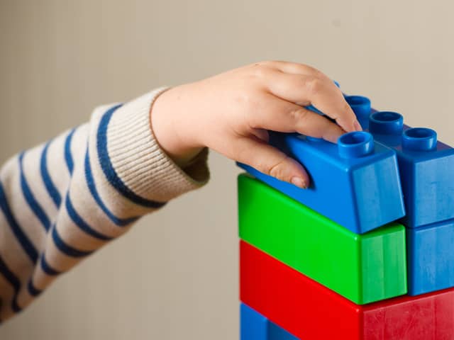 Child plays with building blocks.