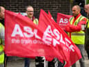LONDON, ENGLAND - MAY 31: A group of rail workers stand on a picket line outside Euston rail station as a new round of strikes by train drivers begins on May 31, 2023 in London, England. Today's strike comes after the train drivers union, ASLEF, rejected a pay rise offer of 4 percent a year over two years from the Rail Delivery Group (RDG). (Photo by Leon Neal/Getty Images)