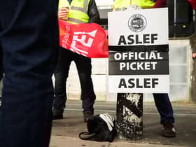 LONDON, ENGLAND - MAY 31: A group of rail workers stand on a picket line outside Euston rail station as a new round of strikes by train drivers begins on May 31, 2023 in London, England. Today's strike comes after the train drivers union, ASLEF, rejected a pay rise offer of 4 percent a year over two years from the Rail Delivery Group (RDG). (Photo by Leon Neal/Getty Images)