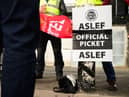 LONDON, ENGLAND - MAY 31: A group of rail workers stand on a picket line outside Euston rail station as a new round of strikes by train drivers begins on May 31, 2023 in London, England. Today's strike comes after the train drivers union, ASLEF, rejected a pay rise offer of 4 percent a year over two years from the Rail Delivery Group (RDG). (Photo by Leon Neal/Getty Images)