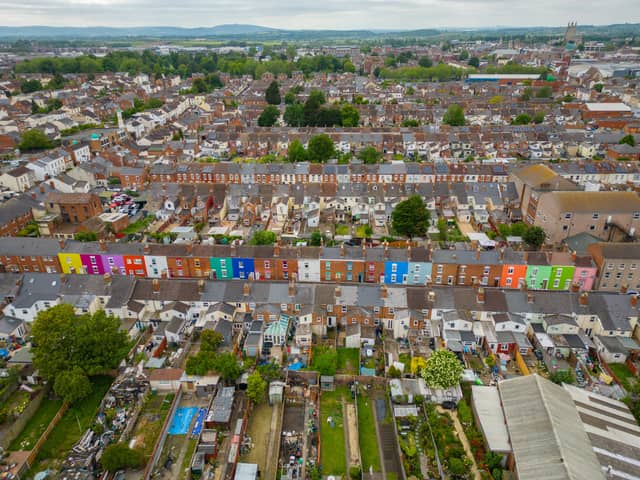 Tasha Frootko and partner Stuart Doust have transformed a street by painting the houses bright colours in Gloucester.