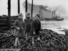 Three young boys attending the launch of 'Empire Crown' at the shipyard of John Readhead & Sons Ltd, South Shields, 16 October 1943