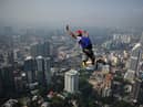 Mark Andrews had taken part in a base jumping event in Kuala Lumpur, Malaysia (Photo credit should read MANAN VATSYAYANA/AFP via Getty Images)