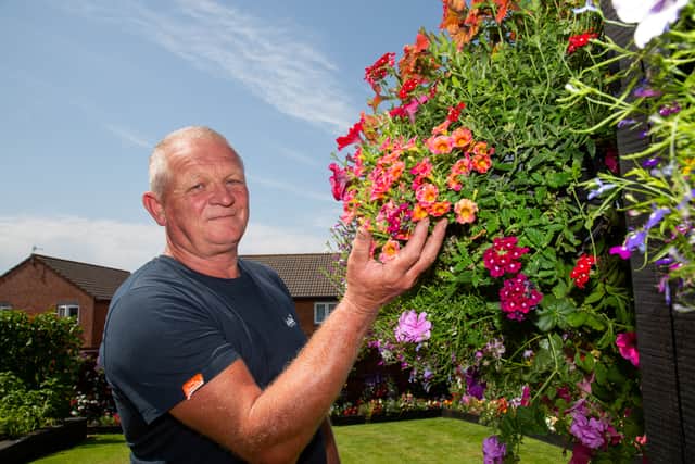 Shaun Schroeder, 59, plants around 140 hanging baskets and fence planters each year.