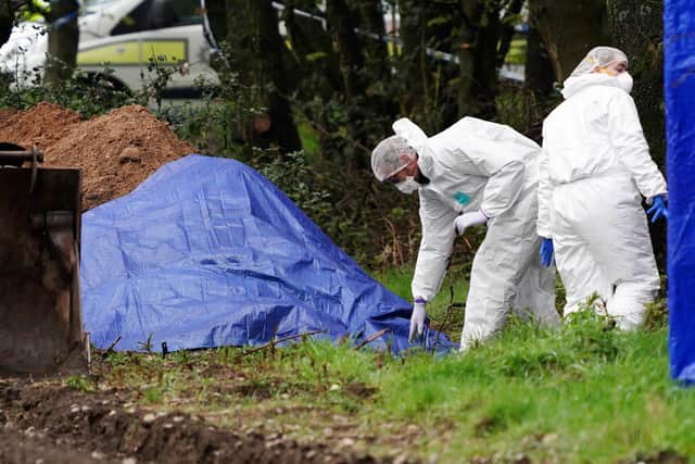 Police forensics work in a field in Sutton-in-Ashfield, Nottinghamshire, after human remains were discovered.
