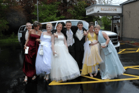 Not even a downpour could spoil the fun for these students. Photo: IB