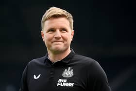 Newcastle manager Eddie Howe looks on and smiles ahead of a match