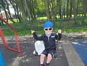 Elijah on the swing with Bella