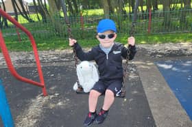 Elijah on the swing with Bella