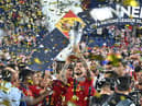 Spain's Joselu lifts the Nations League trophy last night.