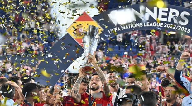 Spain's Joselu lifts the Nations League trophy last night.