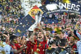 Spain's Joselu lifts the Nations League trophy last night.