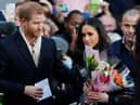 Prince Harry and his then-fiancee, now wife, US actress Meghan Markle arrive to visit the Terrence Higgins Trust World AIDS Day charity fair at Nottingham Contemporary on December 1, 2017