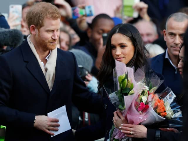 Prince Harry and his then-fiancee, now wife, US actress Meghan Markle arrive to visit the Terrence Higgins Trust World AIDS Day charity fair at Nottingham Contemporary on December 1, 2017