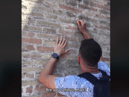 Italian police launch manhunt for a UK tourist who defaced walls of Colosseum