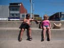 People enjoy the sunshine on the beach in Blackpool, north west England on June 14, 2023.