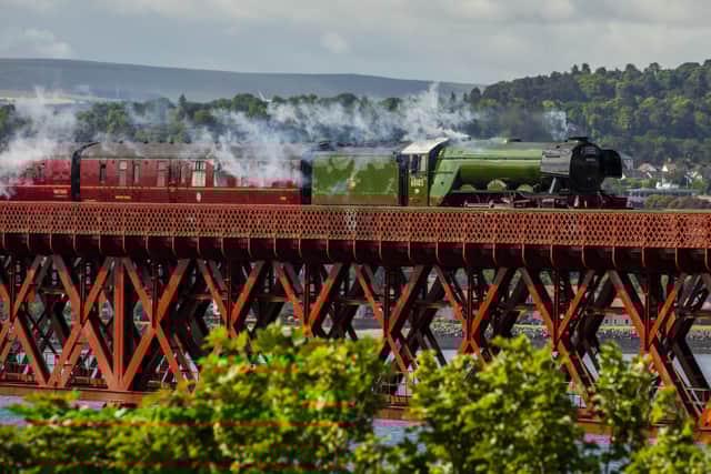Flying Scotsman passes over the Forth Bridge as part of a series of events to celebrate her centenary. The world famous steam locomotive left Edinburgh heading north to Aberdeen. Flying Scotsman passes over the Forth Bridge as part of a series of events to celebrate her centenary. The world famous steam locomotive left Edinburgh heading north to Aberdeen.