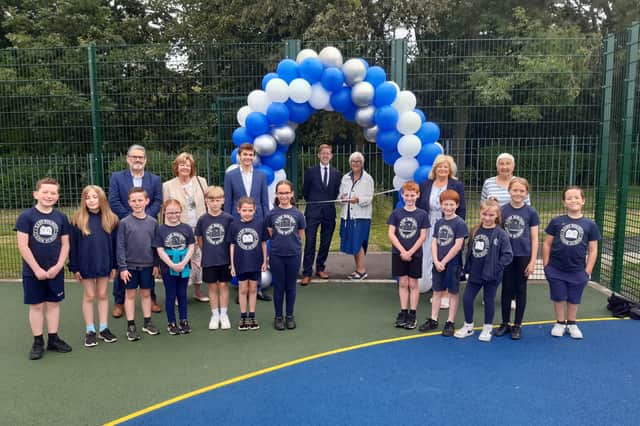 Staff and children celebrate opening of new £50,000 multi use games area 