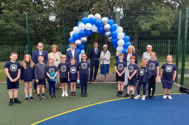 Staff and children celebrate opening of new £50,000 multi use games area