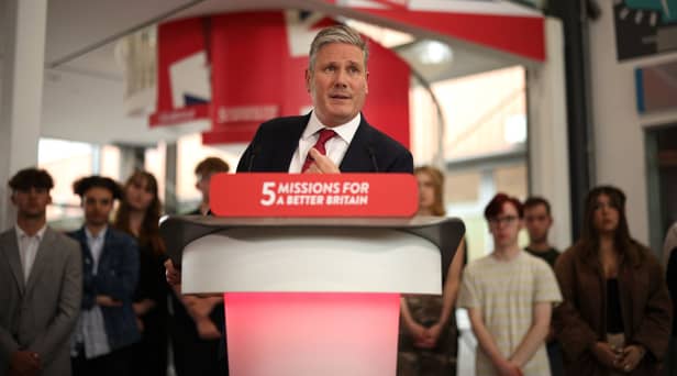 Sir Keir Starmer heckled on stage by green protesters who demand ‘no more U-turns’ from Labour leader 