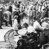 Bank Holiday crowds at the South Marine Park in August 1980. They are watching as a steam engine takes another load of passengers for a trip around the lake. Photo: Shields Gazette