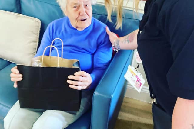Resident receiving a wellbeing pack