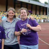 Annual Cancer Research UK Relay for Life organiser Ann Walsh at Monkton Stadium with survivors Bobby Jak, 12 and Lillie Slater, 19.