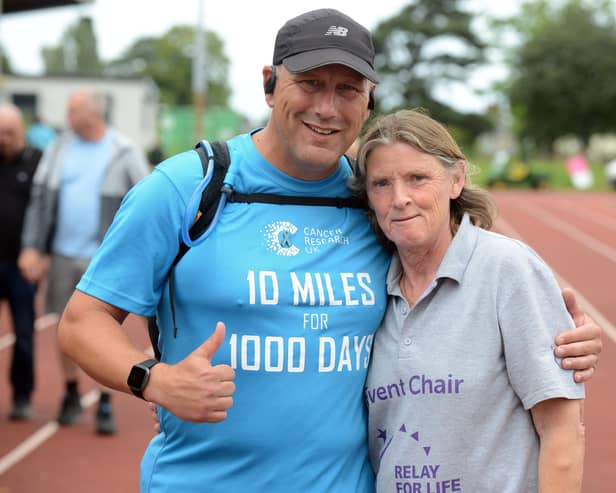 Annual Cancer Research UK Relay for Life organiser Ann Walsh at Monkton Stadium with David Ansell who is walking 10 miles a day for a 100 days.