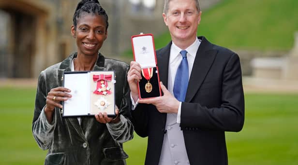 Sharon White poses with her award after she was made a Dame CBE, for public service, next to her husband Sir Robert Chote (Photo by Andrew Matthews - WPA Pool/Getty Images)