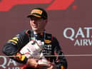 Max Verstappen holds the broken Hungarian Grand Prix trophy 