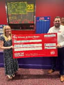 Elaine receiving her prize money